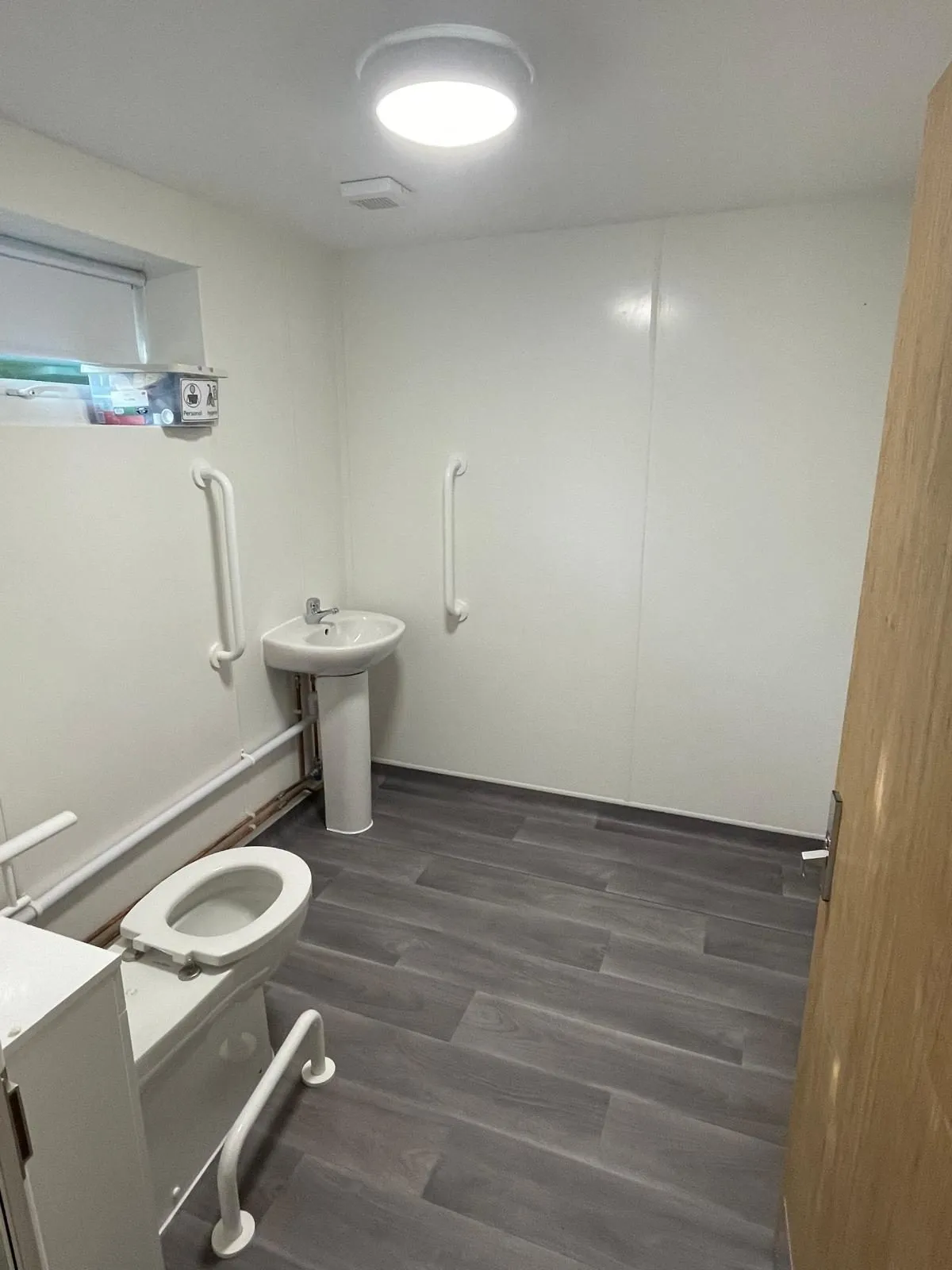 Commercial renovation egham after accessible wc by Trade Square