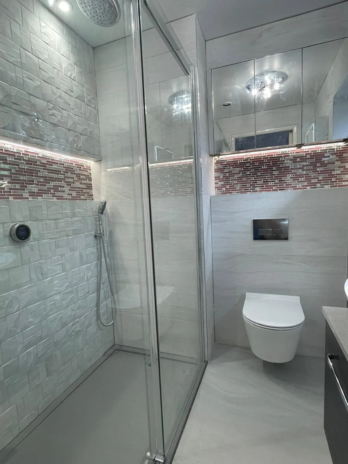 Shower room in Egham with walk-in shower and wall-hung WC