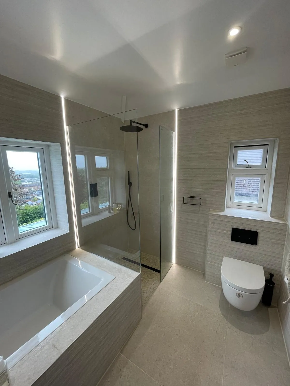 Bathroom renovation in Egham with bath and glass walk-in shower
