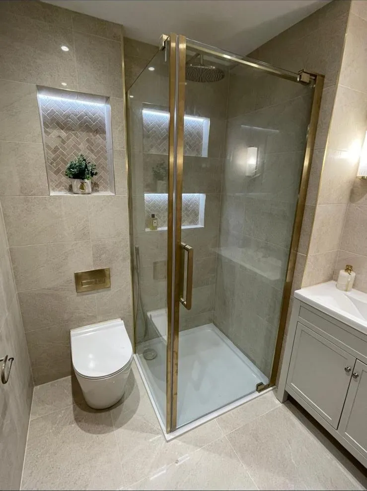 Shower room with brushed brass enclosure and vanity, Egham
