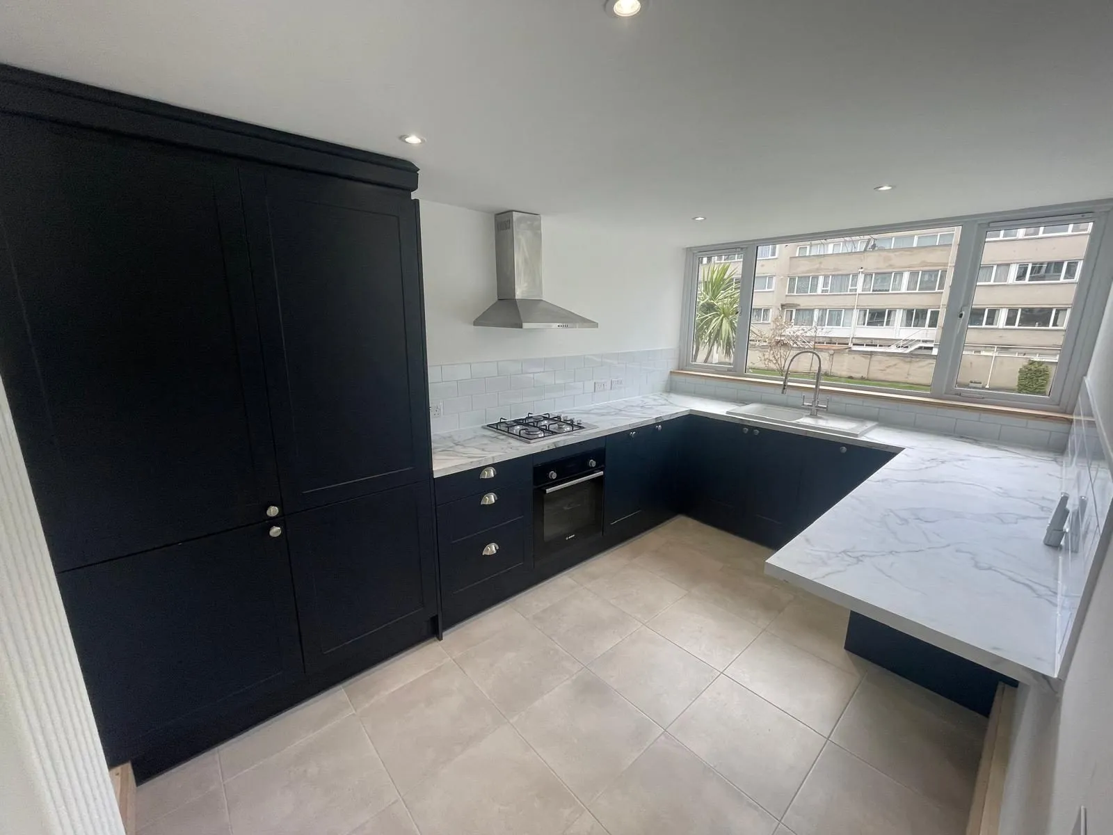 Flat renovation egham after navy shaker kitchen by Trade Square