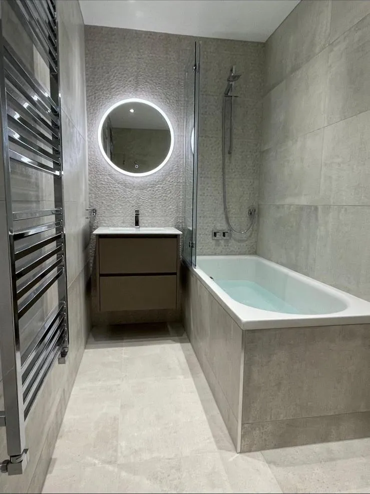 Shower bath with LED mirror fitted in an Egham bathroom