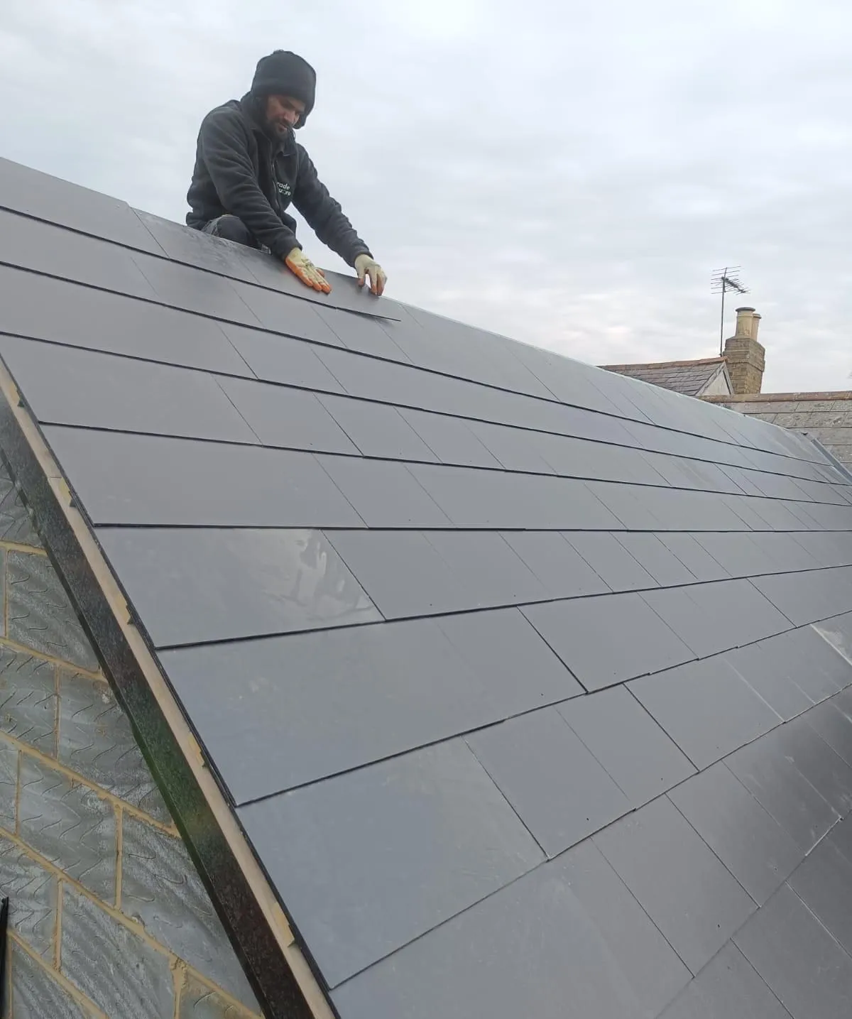 Roof slating on a double-storey extension, Egham