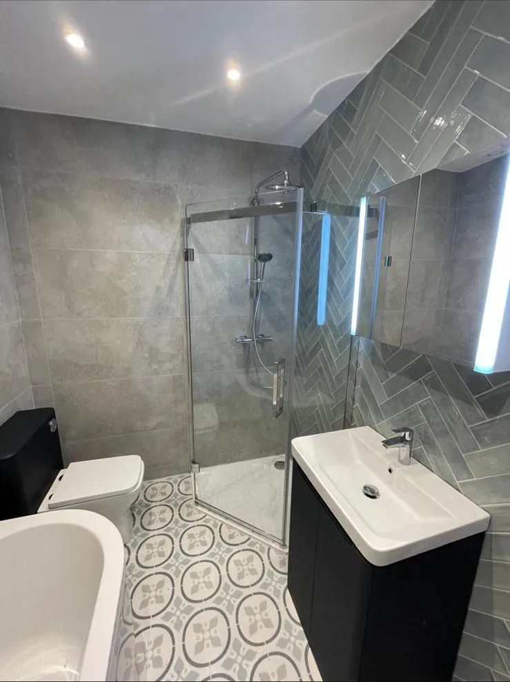 Bathroom renovation egham herringbone tiles by Trade Square